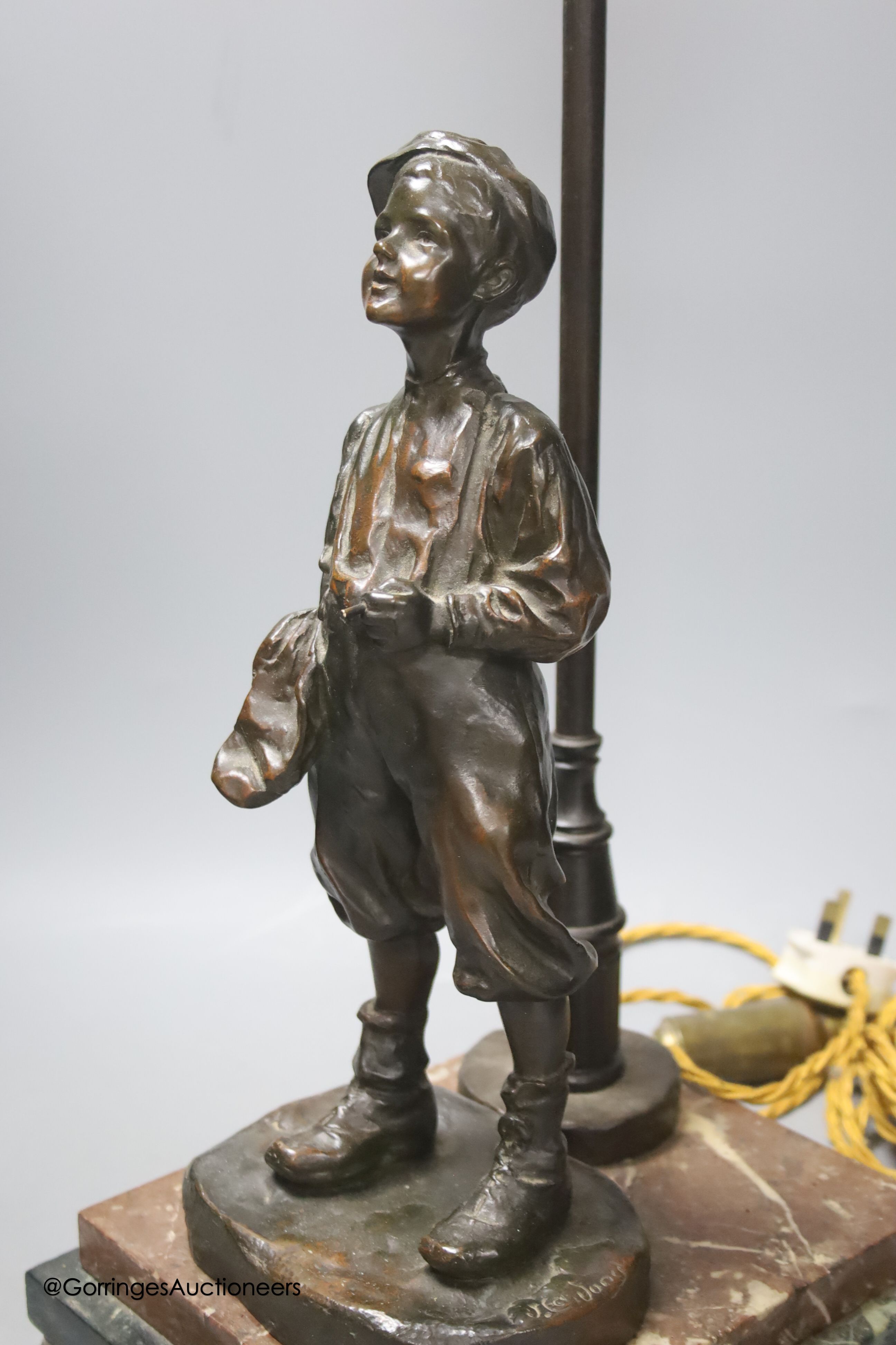 A bronze desk lamp, a boy standing beneath a street lamp, signed, height 62cm